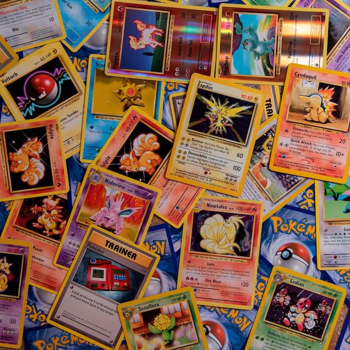 A bunch of Pokémon Trading Cards with Zapdos, Ninetales, Porygon, Cyndaquil, Ponyta, Machop, Vulpix and many more.